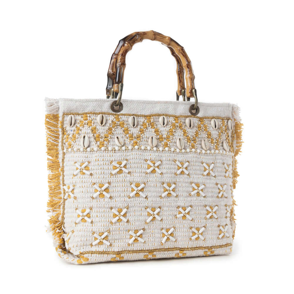 Myra Sunset Creek Embroidered Small Bag in Coastal White featuring intricate embroidery and cowrie shells.