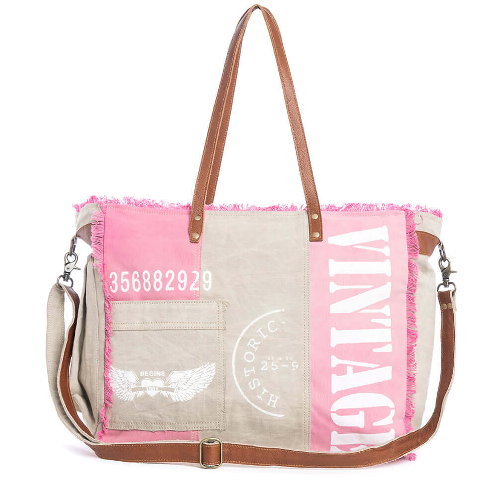 Myra Queen Creek Weekender Bag in Pink - Spacious Leather Travel Tote with Patchwork, Leather Handles, and Playful Retro Vibes.