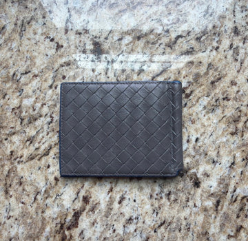 Gray woven Bottega Veneta money clip wallet exterior showing edge wear