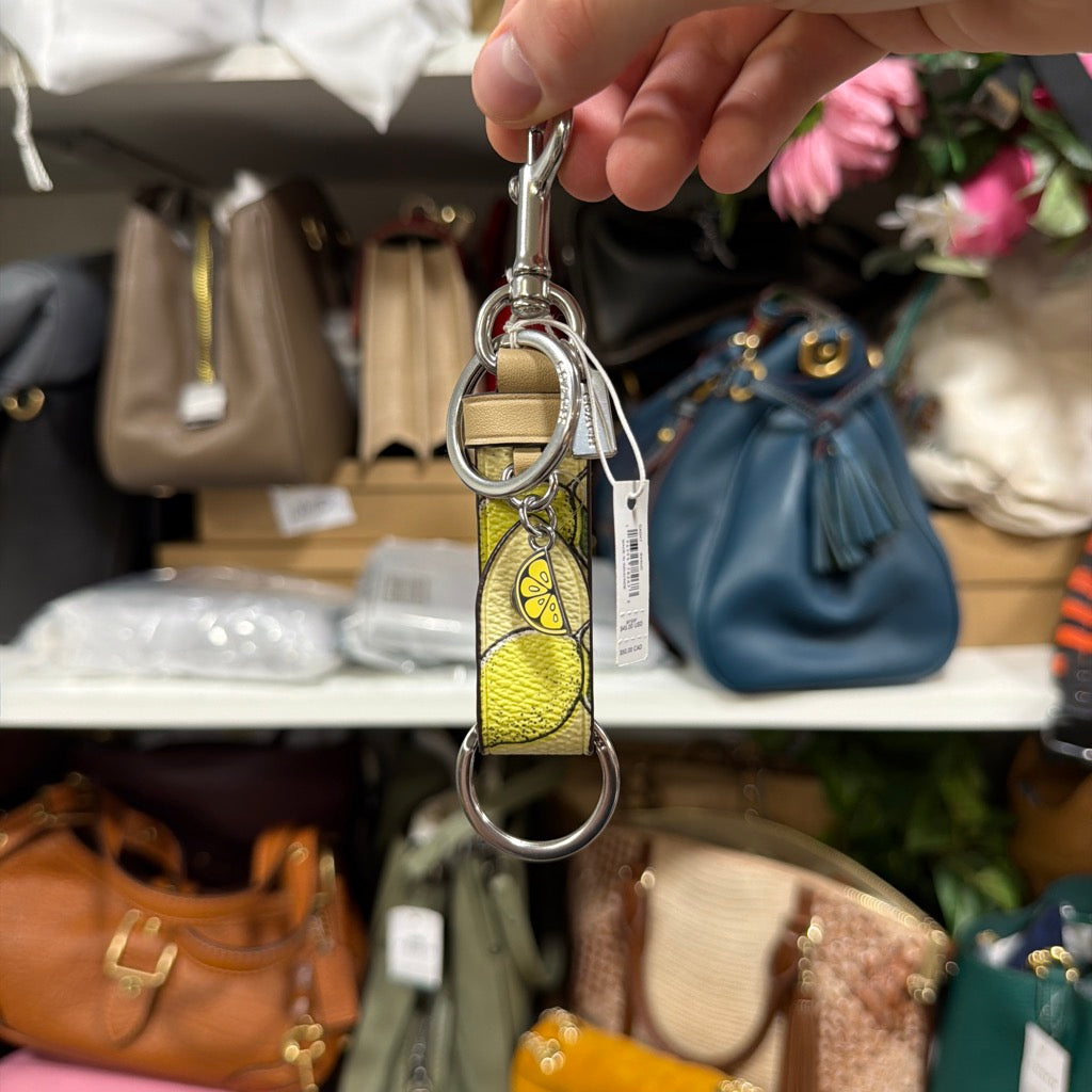 Coach Trigger Snap Bag Charm Key Fob Lemon Print CAO47 front with lemon slice charm