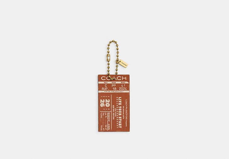 Coach Concert Ticket Bag Charm CHQ91 burnished amber stock photo