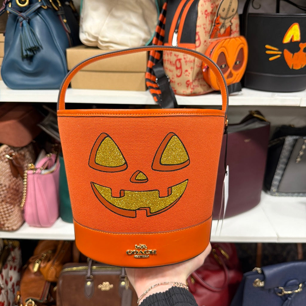 Actual item front with gold glitter pumpkin face