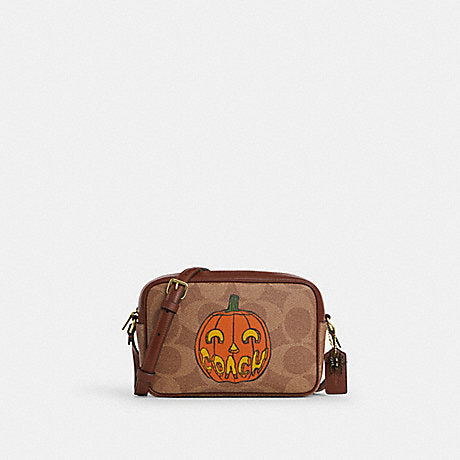 Coach Jamie Camera Bag in Signature Canvas with Halloween Pumpkin Print CCK86 stock photo