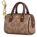 Coach Mini Rowan Bag Charm In Signature Canvas CX068 Gold Tan Brown stock photo