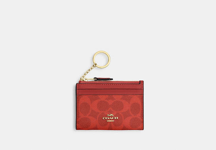 Coach CW870 Mini Skinny ID Case Signature Canvas Crimson stock photo
