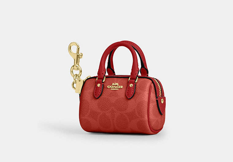 Coach Mini Rowan Bag Charm CX068 crimson stock photo