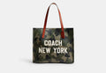 Coach Relay Tote with camo print and Coach New York graphic CY808 stock photo