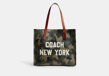 Coach Relay Tote with camo print and Coach New York graphic CY808 stock photo