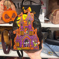 Actual item front with haunted house