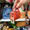 Coach mini Rowan bag charm side with clip
