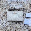Coach CDF04 Chalk wristlet front with tags and dust cloth