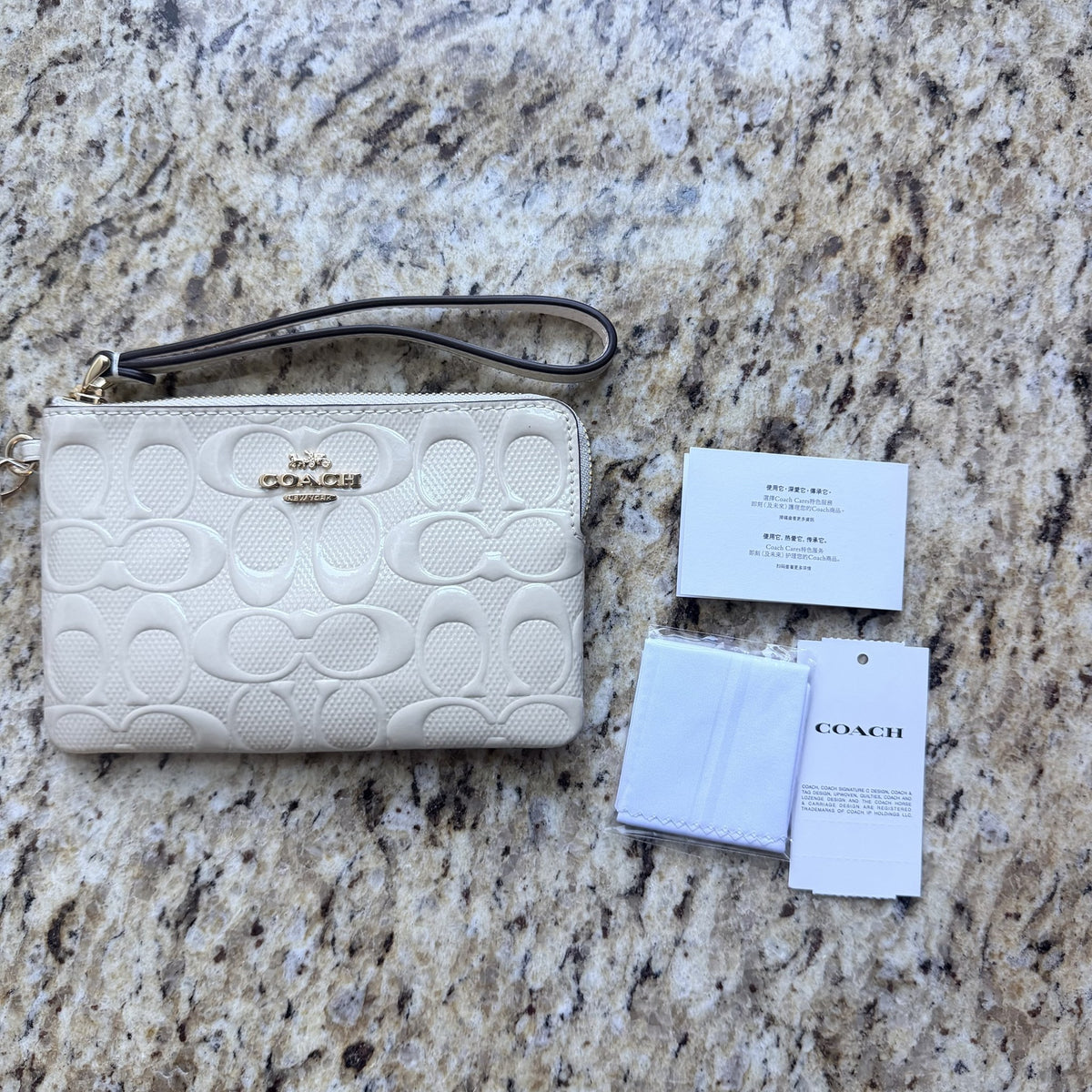 Coach CDF04 Chalk wristlet front view