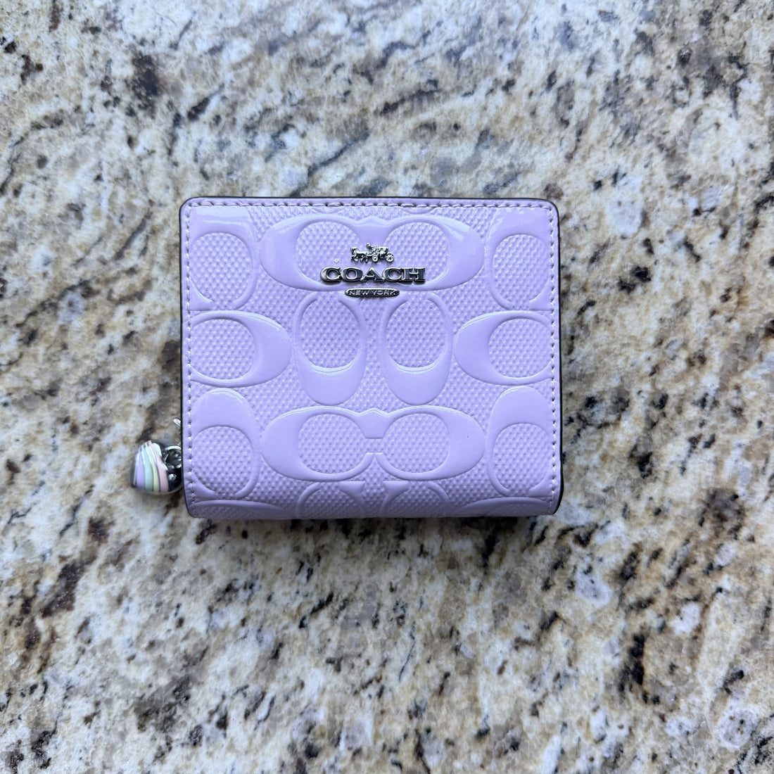 Coach CDF21 Snap Wallet Signature Leather Heart Charm Light Violet stock photo