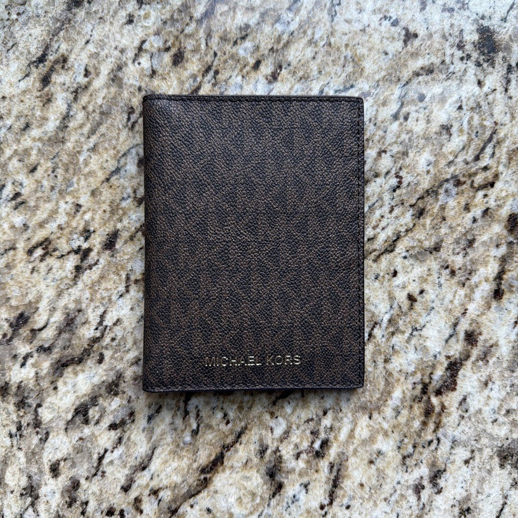 Michael Kors brown logo passport wallet front
