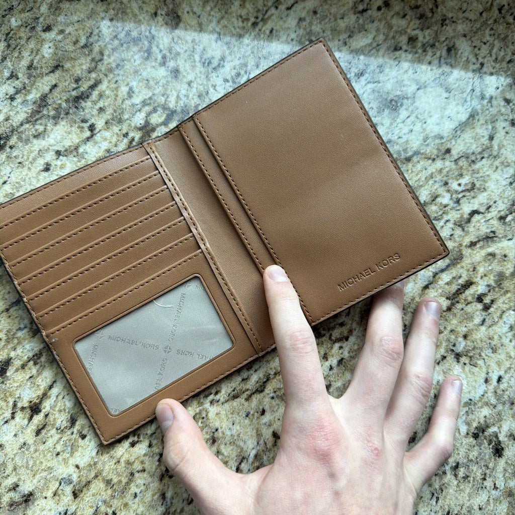 Michael Kors brown logo passport wallet front