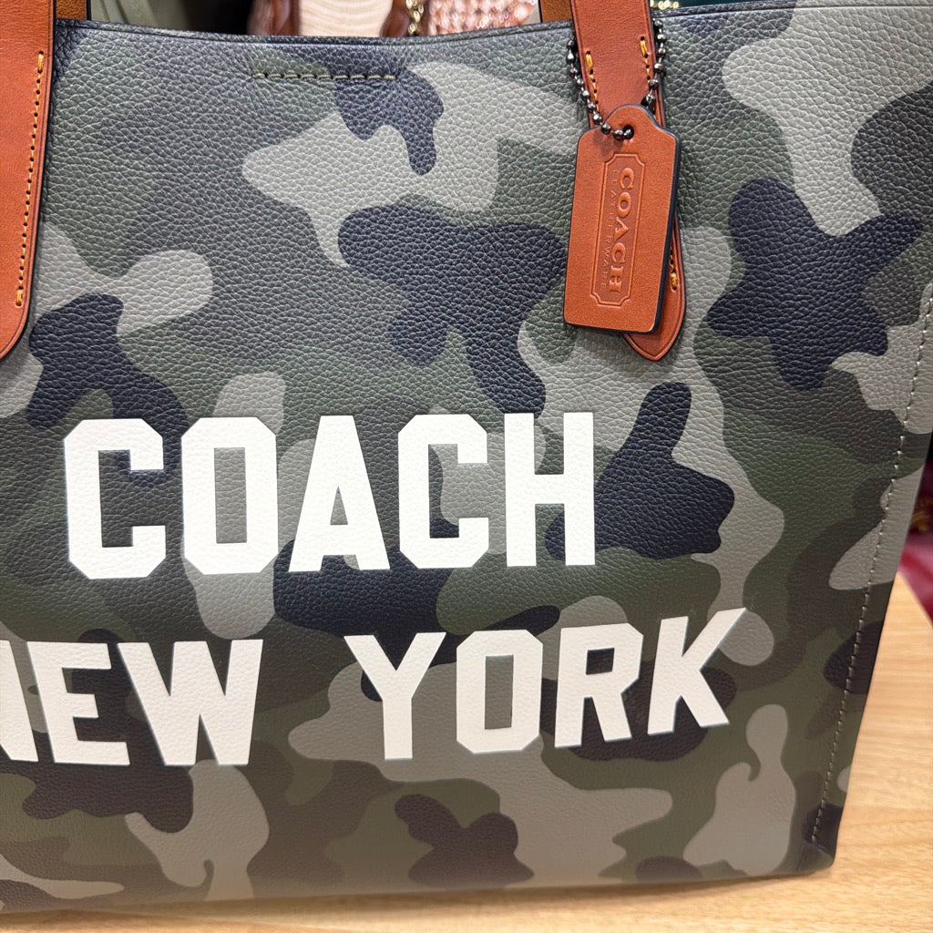 Coach New York graphic and leather hangtag close-up